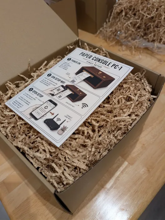 Paper Console PC-1 packaged with setup card and paper crinkle